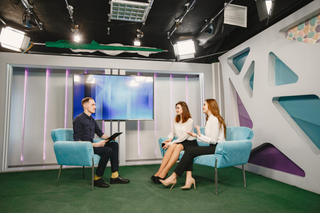 Guests being interviewed on a TV morning show set