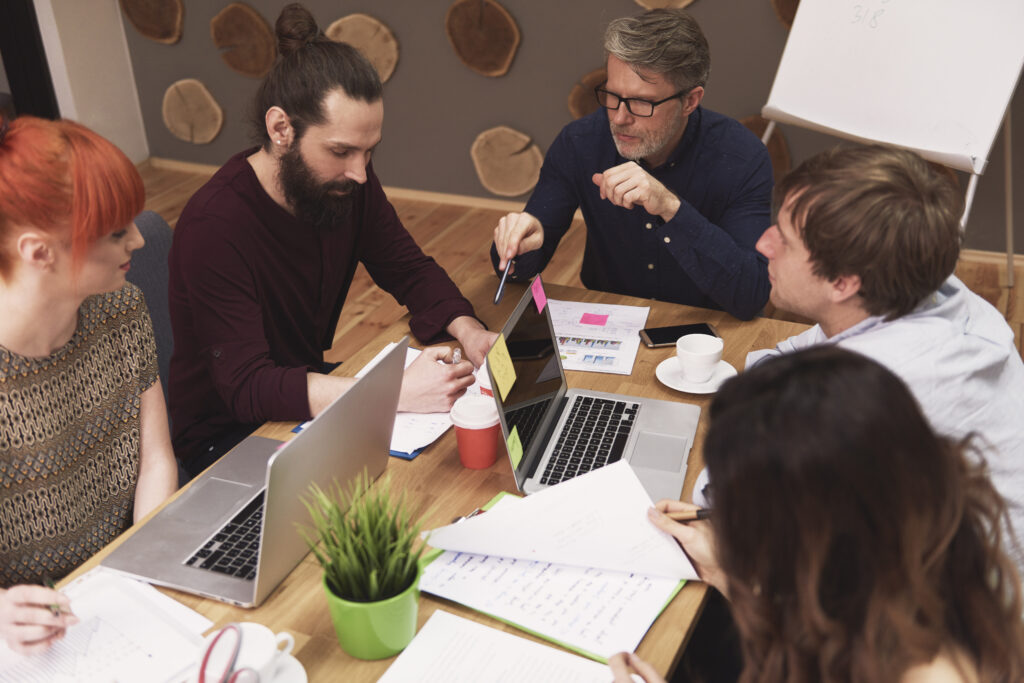 An agency team reviewing campaign results together