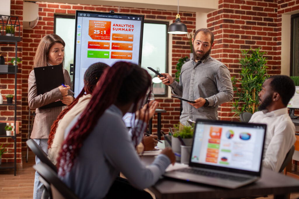 A business team analysing CRM data on screen
