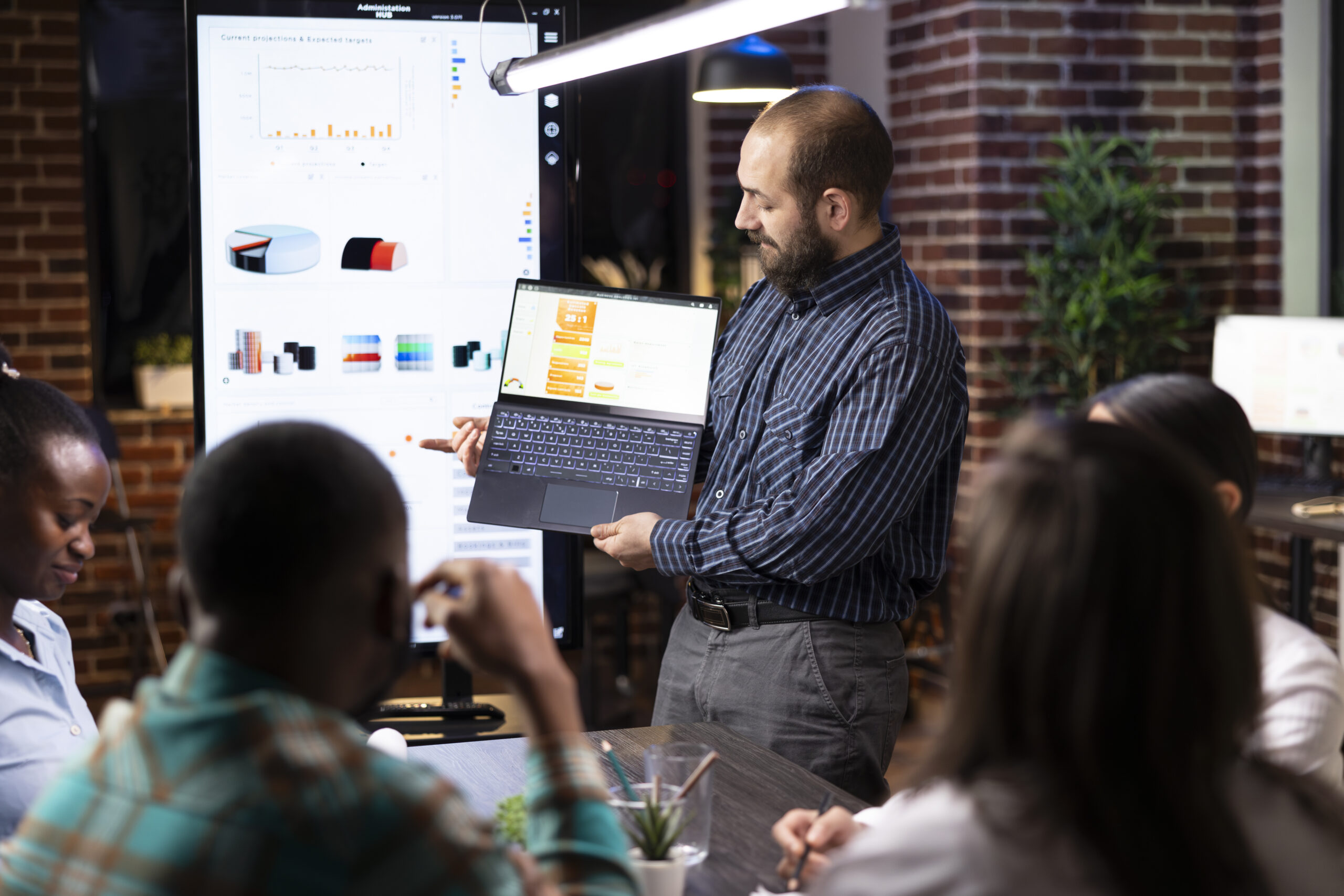 A consultant presenting business analytics to a client team