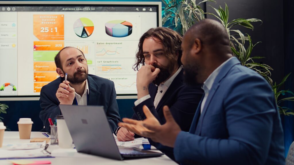 A corporate team reviewing project timelines in a boardroom
