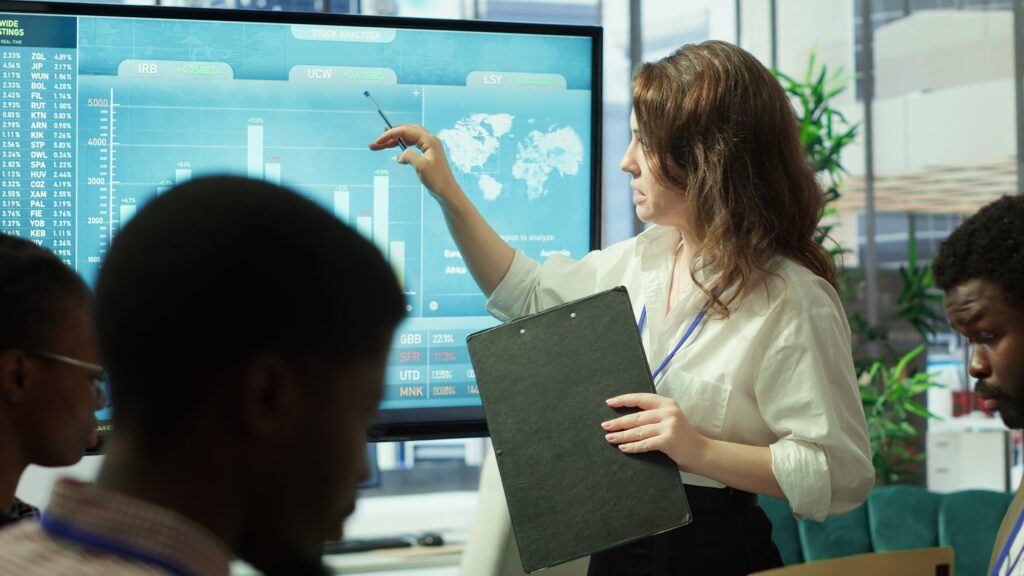 Business associates reviewing performance indicators together
