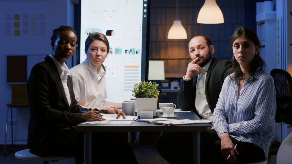 Business leaders around a conference table discussing company strategy